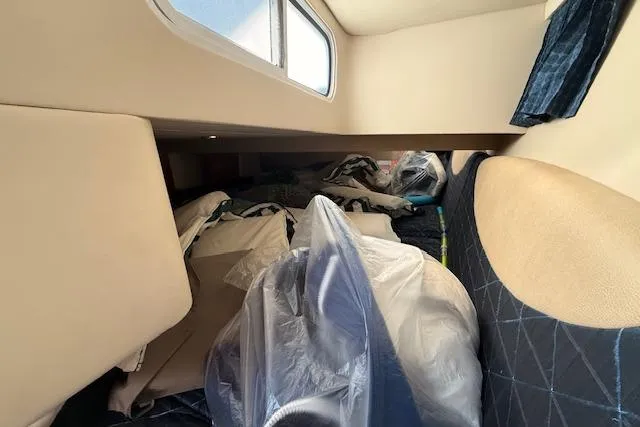 Slide: The Image of Interior cabin of 2008 Formula 350 Sun Sport boat with storage items. - 15