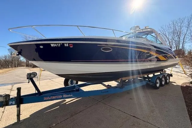 Slide: The Image of 2008 Formula 350 Sun Sport boat on trailer under clear blue sky. - 2