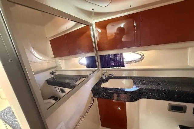Slide: The Image of 2008 Formula 350 Sun Sport bathroom with modern fixtures and wood cabinetry. - 20
