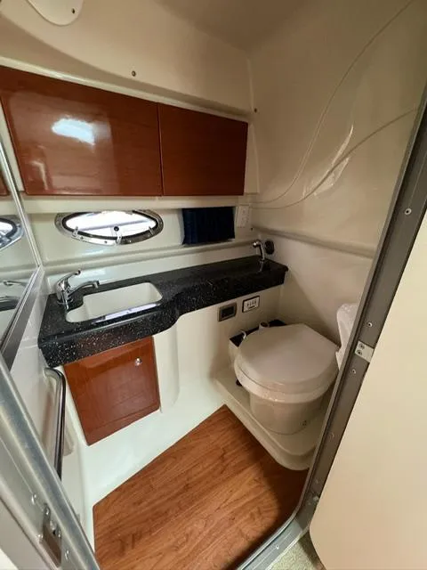 Slide: The Image of 2008 Formula 350 Sun Sport interior with bathroom and wood accents. - 21