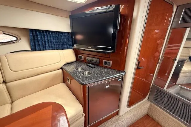 Slide: The Image of Interior of 2008 Formula 350 Sun Sport with TV, seating, and kitchenette. - 22