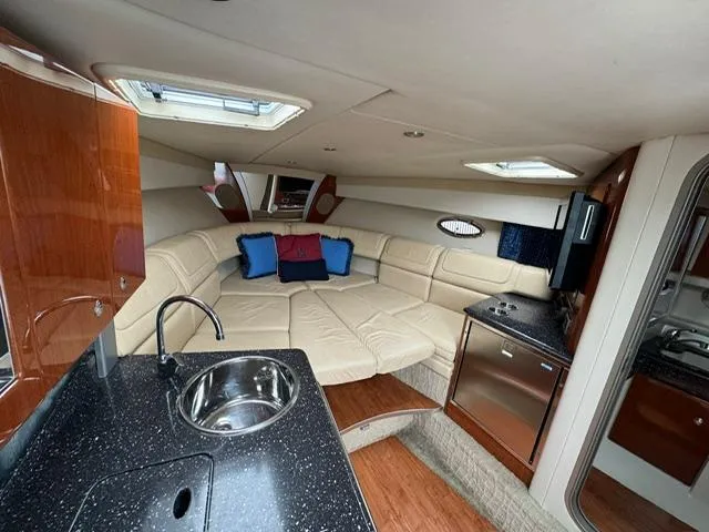 Slide: The Image of Interior of a 2008 Formula 350 Sun Sport yacht with leather sofa and kitchenette. - 24