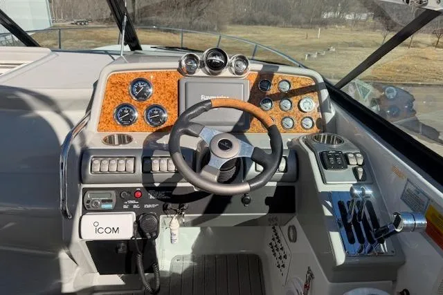 Slide: The Image of 2008 Formula 350 Sun Sport boat dashboard with steering wheel and control panel. - 30