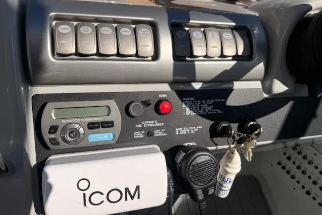 Slide: The Image of Control panel of a 2008 Formula 350 Sun Sport boat with ICOM radio equipment. - 32