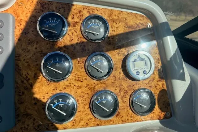 Slide: The Image of Dashboard of 2008 Formula 350 Sun Sport with wood finish and multiple gauges. - 34