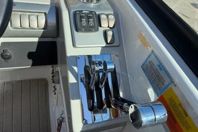 Slide: The Image of Control panel of a 2008 Formula 350 Sun Sport boat with chrome throttle levers. - 35