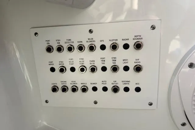 Slide: The Image of Control panel of a 2008 Formula 350 Sun Sport boat with labeled switches and buttons. - 36