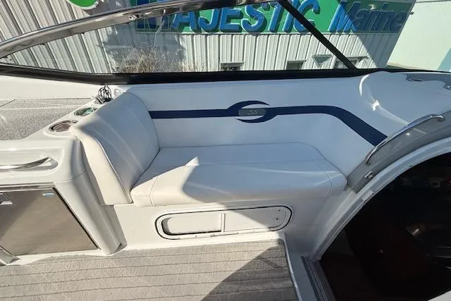 Slide: The Image of 2008 Formula 350 Sun Sport boat interior with white seating and blue accents. - 38