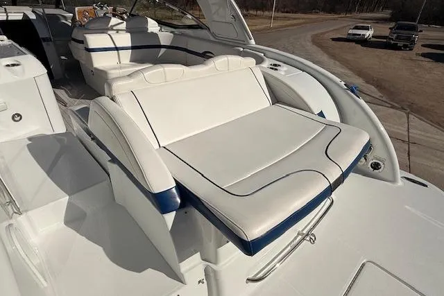 Slide: The Image of 2008 Formula 350 Sun Sport boat with white and blue seating on deck. - 42