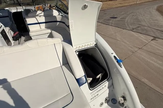 Slide: The Image of 2008 Formula 350 Sun Sport boat with open storage compartment on deck. - 44