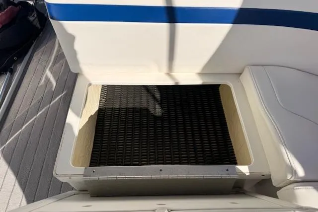 Slide: The Image of Storage compartment on a 2008 Formula 350 Sun Sport boat, featuring a black mat. - 46
