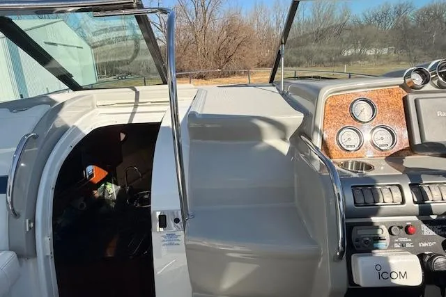 Slide: The Image of 2008 Formula 350 Sun Sport boat cockpit with control panel and open cabin door. - 48