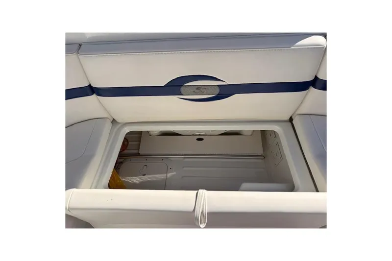 Slide: The Image of 2008 Formula 350 Sun Sport boat interior storage compartment with white and blue upholstery. - 50