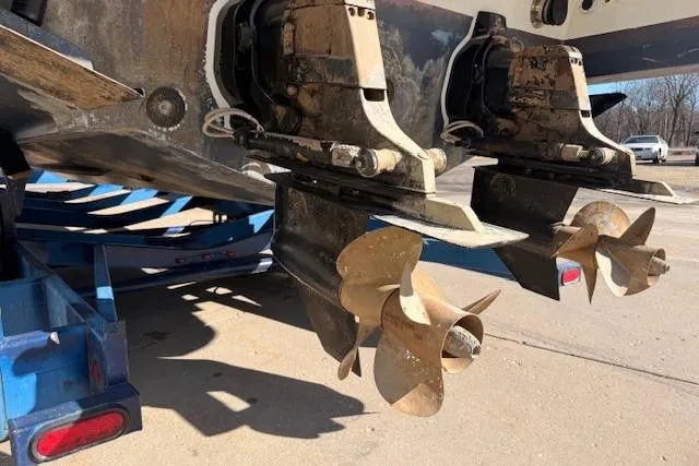 Slide: The Image of 2008 Formula 350 Sun Sport boat propellers on a trailer, close-up view. - 60