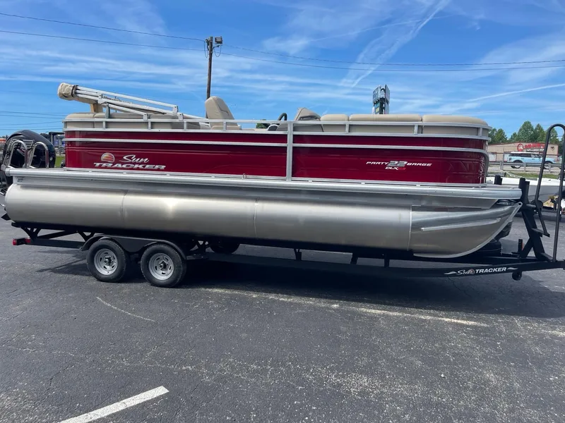 Slide: The Image of 2024 Sun Tracker Party Barge 22 RF XP3 pontoon boat on trailer, side view. - 12
