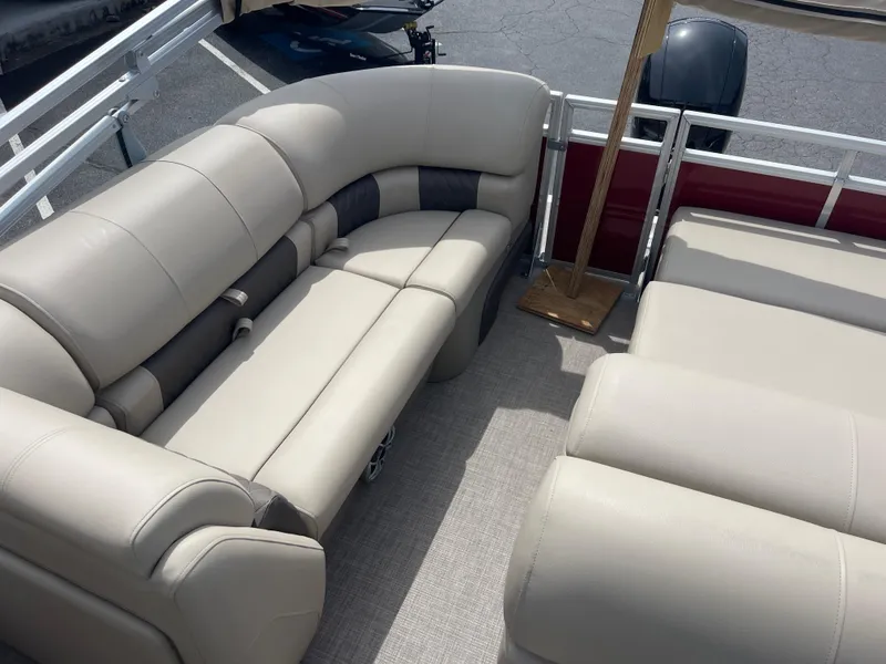 Slide: The Image of 2024 Sun Tracker Party Barge 22 RF XP3 interior seating area with beige upholstery. - 5
