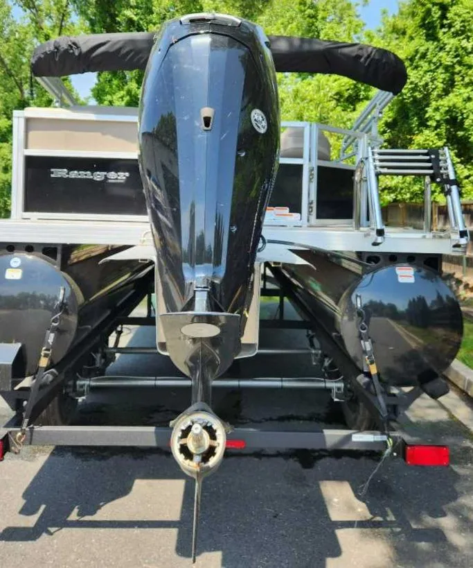 Slide: The Image of 2024 Ranger Reata 200C pontoon boat rear view with outboard motor. - 6