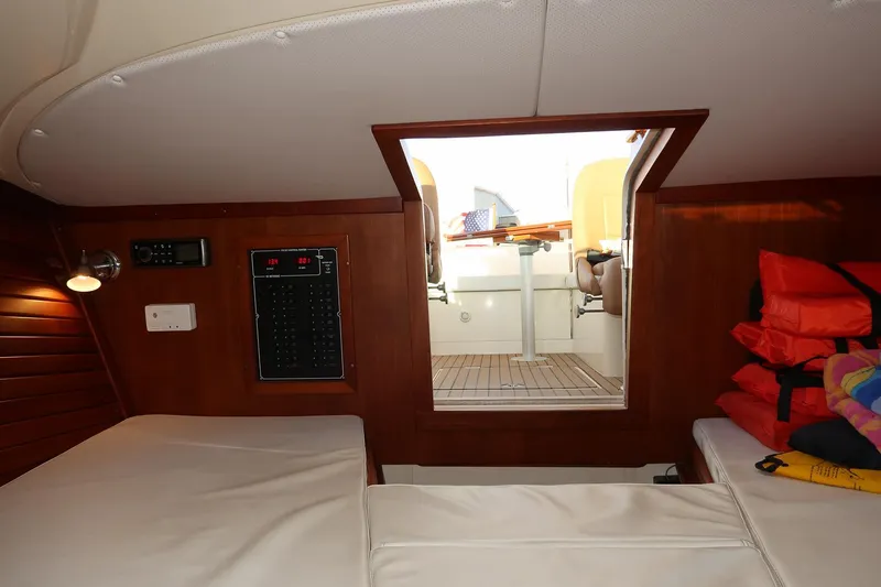 Slide: The Image of Interior cabin of 2004 Hinckley Talaria 29 Runabout with seating and life jackets. - 19