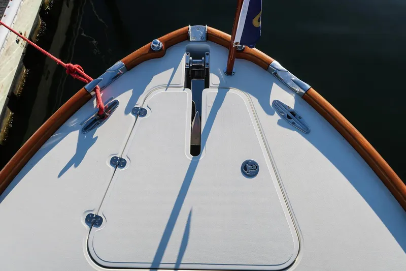 Slide: The Image of Bow of 2004 Hinckley Talaria 29 Runabout with wooden trim and deck fittings. - 22