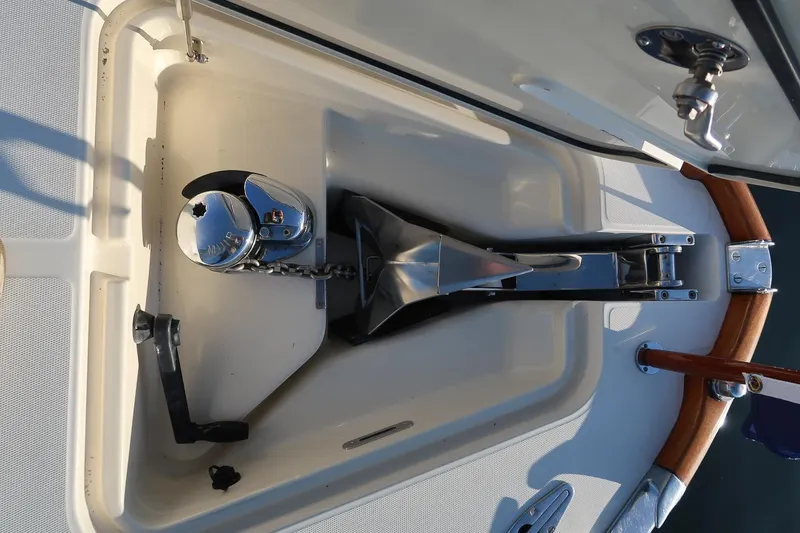 Slide: The Image of Anchor compartment of 2004 Hinckley Talaria 29 Runabout with polished metal fittings. - 23