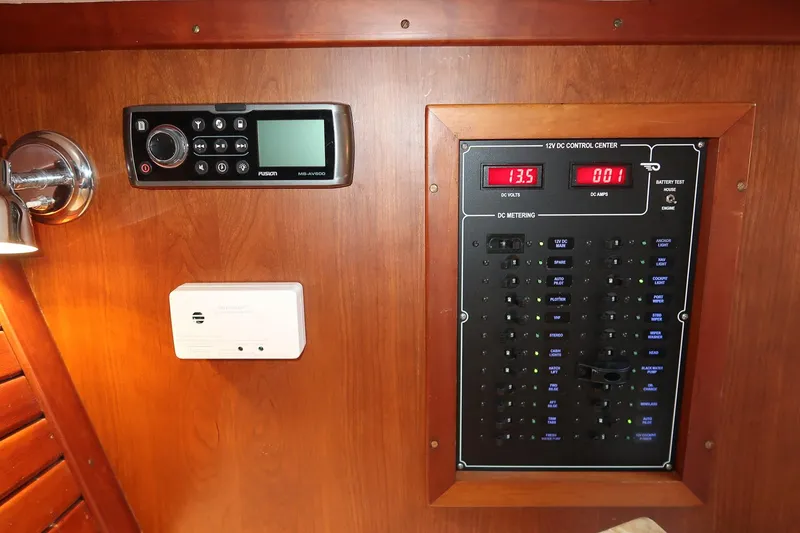 Slide: The Image of 2004 Hinckley Talaria 29 Runabout control panel with radio and electrical system. - 24