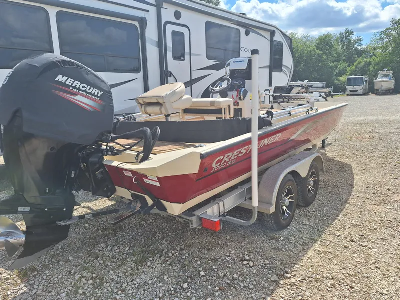 Slide: The Image of 2016 Crestliner Bay 2000 boat with Mercury outboard motor on trailer. - 6