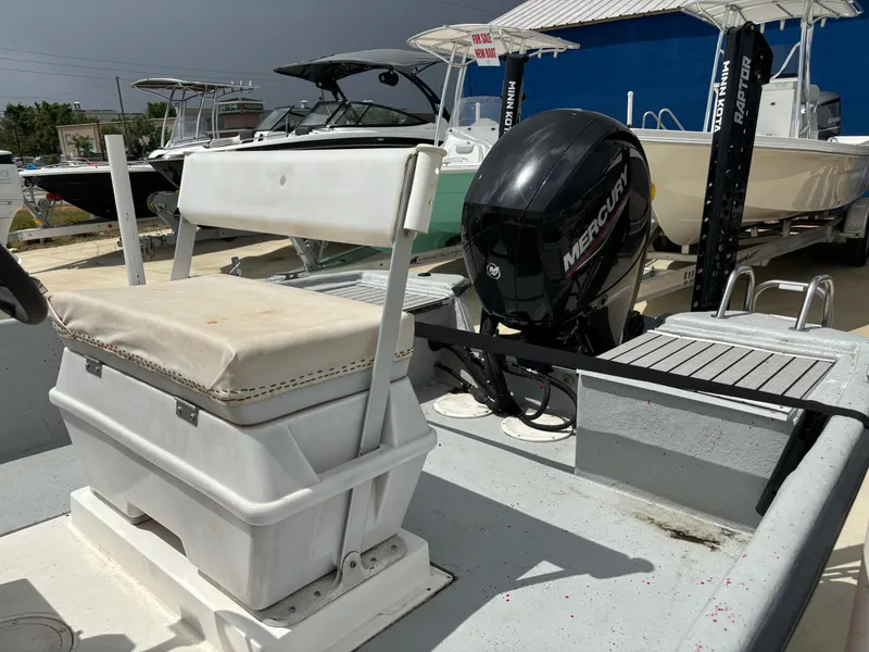 Slide: The Image of 1997 Hydra-Sports 21 boat with Mercury outboard motor, docked in a marina. - 10
