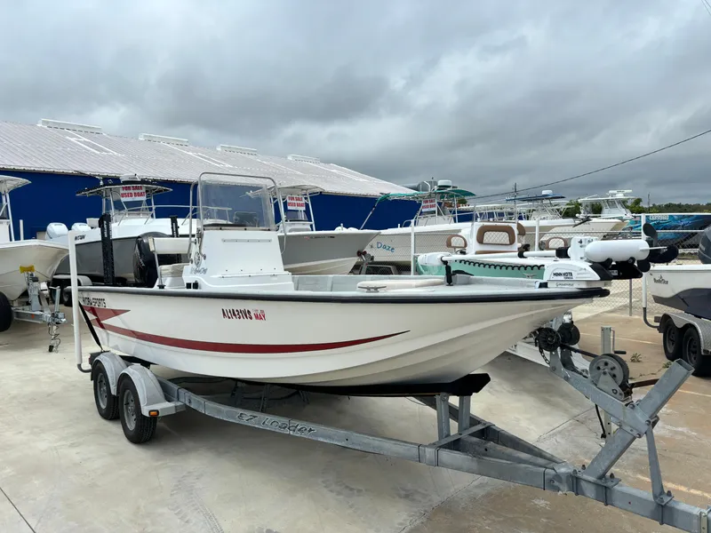 Slide: The Image of 1997 Hydra-Sports 21 boat on trailer, parked at marina under cloudy skies. - 13