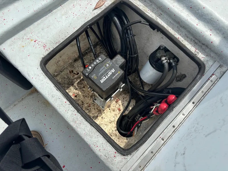 Slide: The Image of 1997 Hydra-Sports 21 boat compartment with wiring and equipment. - 14