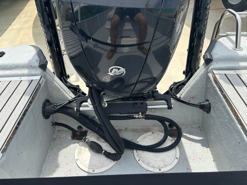 Slide: The Image of 1997 Hydra-Sports 21 boat engine and deck view with cables and fittings. - 16