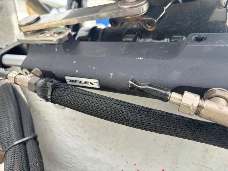 Slide: The Image of Close-up of hydraulic steering system on a 1997 Hydra-Sports 21 boat. - 17