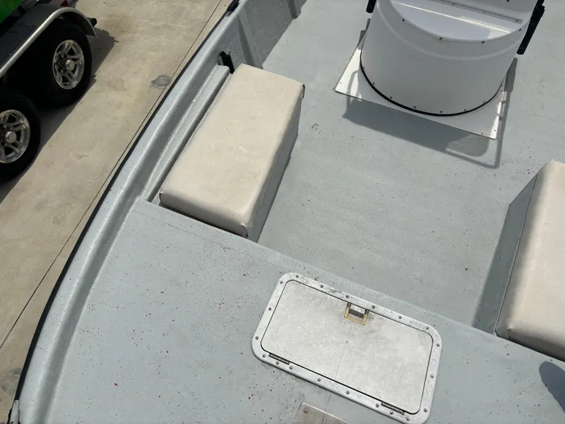 Slide: The Image of 1997 Hydra-Sports 21 boat interior with seating and storage hatch. - 18