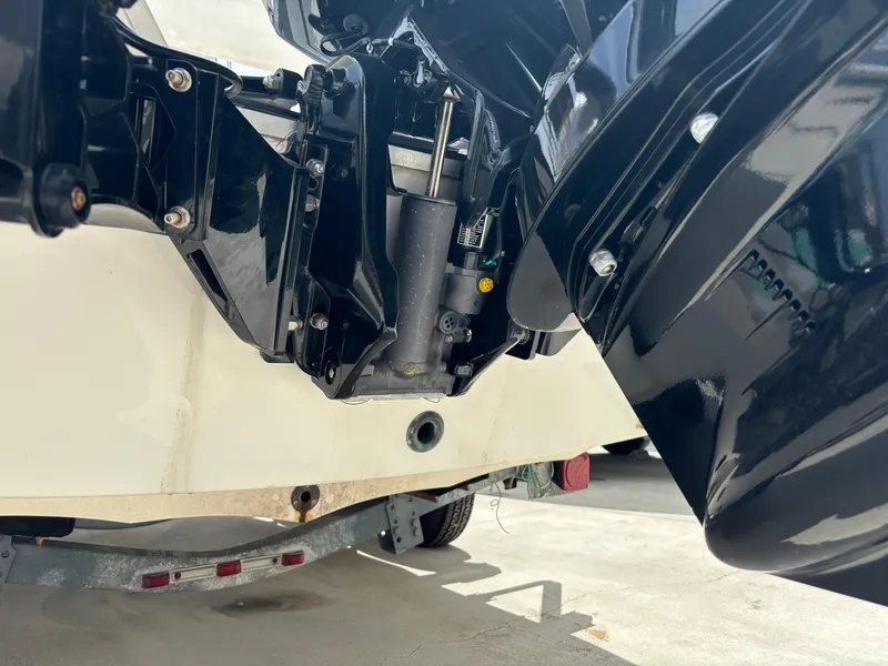 Slide: The Image of 1997 Hydra-Sports 21 boat engine close-up on trailer. - 2