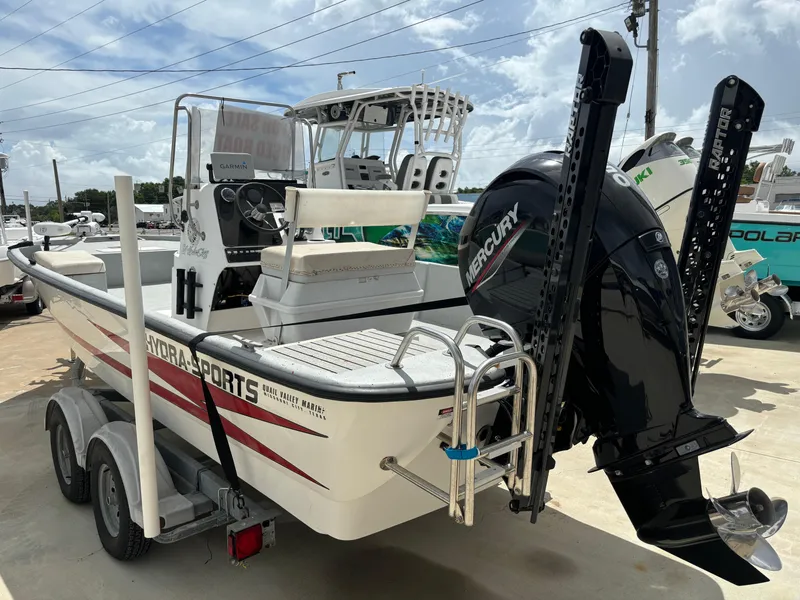 Slide: The Image of 1997 Hydra-Sports 21 boat with Mercury engine on trailer, parked outdoors. - 4
