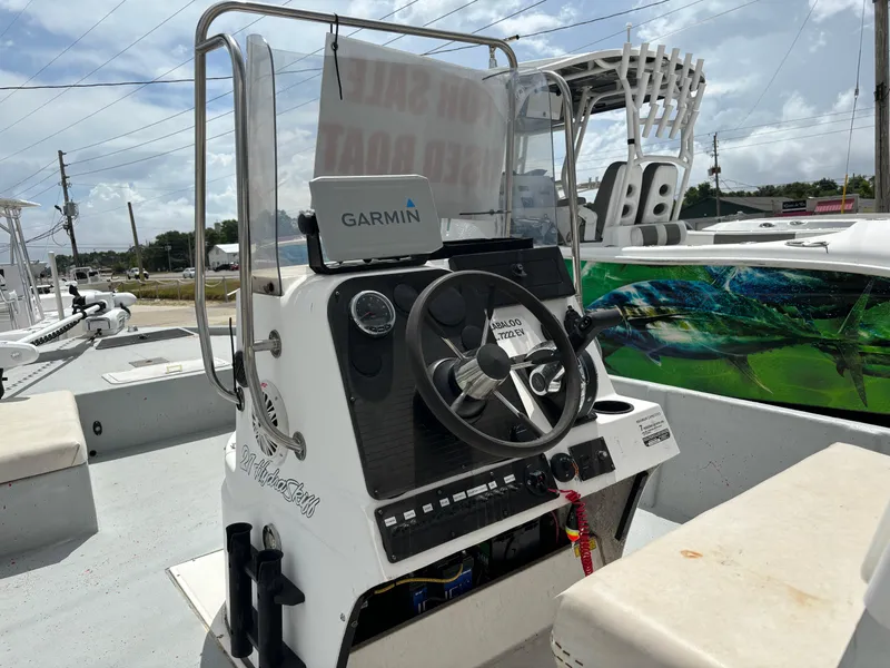 Slide: The Image of 1997 Hydra-Sports 21 boat console with Garmin GPS, steering wheel, and controls. - 5