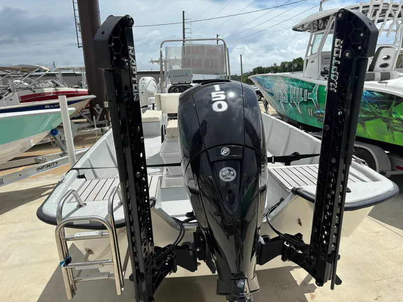 Slide: The Image of 1997 Hydra-Sports 21 boat with powerful 150 HP engine, docked at marina. - 8