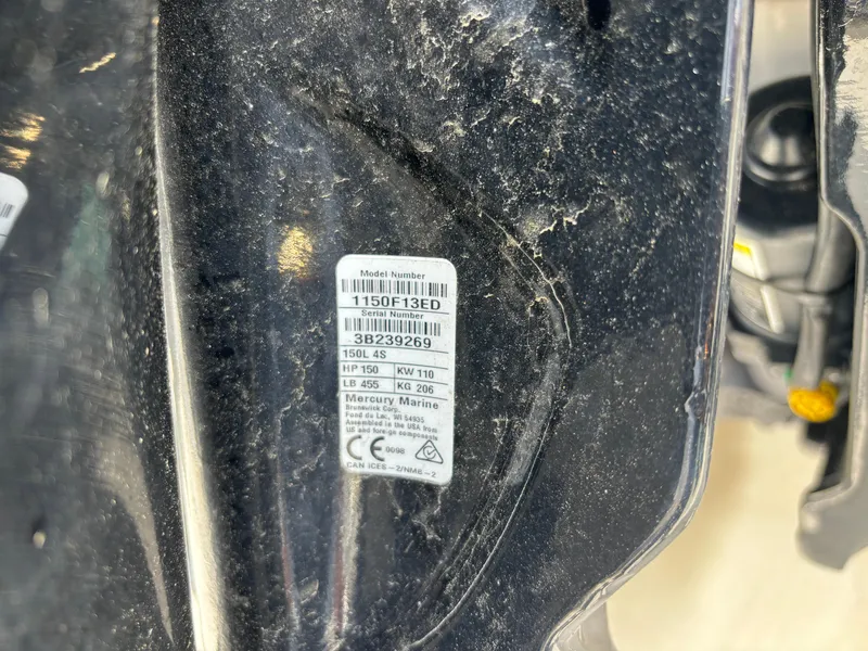 Slide: The Image of Close-up of a Mercury Marine engine label on a 1997 Hydra-Sports 21 boat. - 9