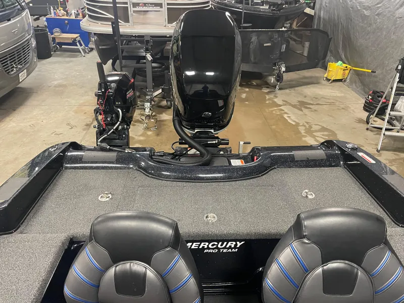 Slide: The Image of 2022 Nitro ZV21 boat with Mercury Pro Team engine in a garage. - 11