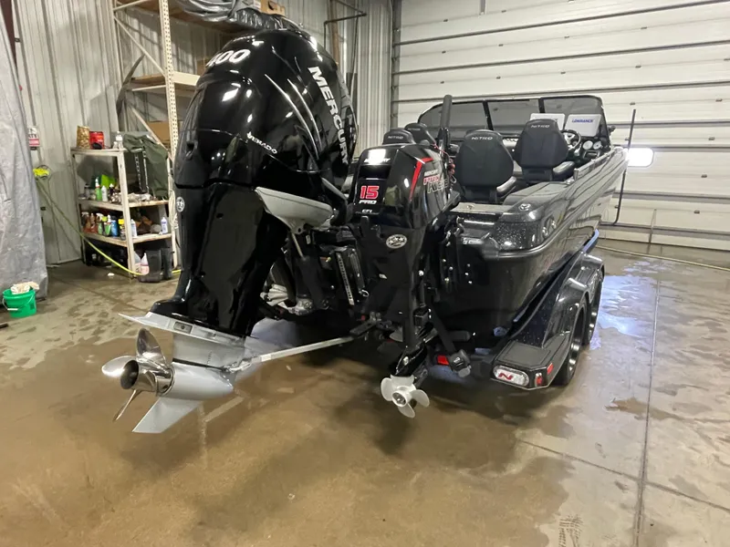 Slide: The Image of 2022 Nitro ZV21 boat with Mercury outboard motor in a garage. - 3