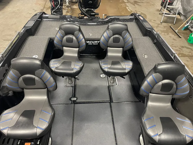 Slide: The Image of 2022 Nitro ZV21 boat interior with four black and gray seats, Mercury Pro XS engine. - 5