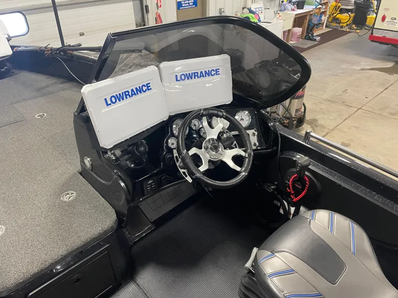 Slide: The Image of 2022 Nitro ZV21 boat dashboard with Lowrance electronics and steering wheel. - 9