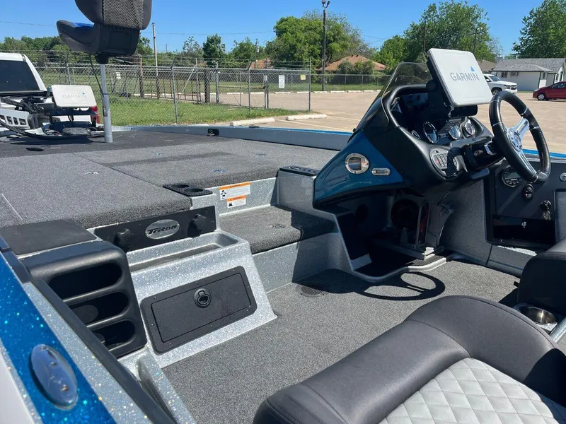 Slide: The Image of 2020 Triton 21 TRXS boat trailer with dual black alloy wheels. - 16