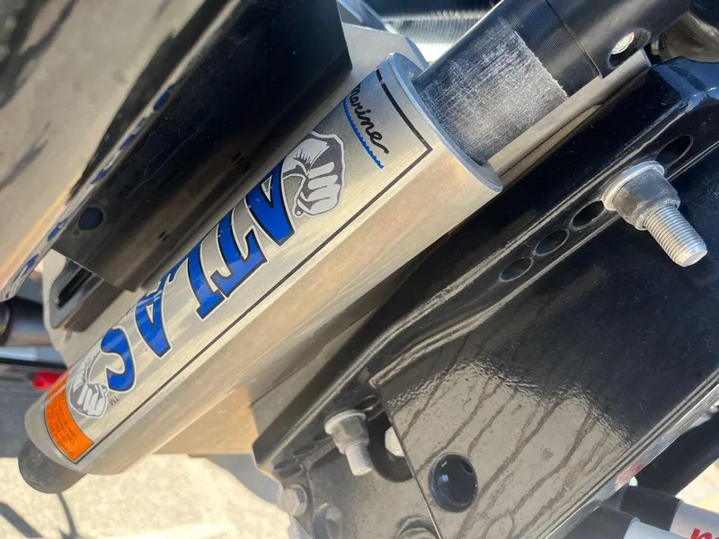 Slide: The Image of 2020 Triton 21 TRXS bass boat on trailer in parking lot. - 20