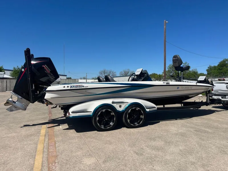 Slide: The Image of 2020 Triton 21 TRXS boat seat in outdoor setting. - 23