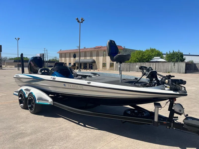 Slide: The Image of 2020 Triton 21 TRXS boat with Texas Boat World and Triton decals. - 24