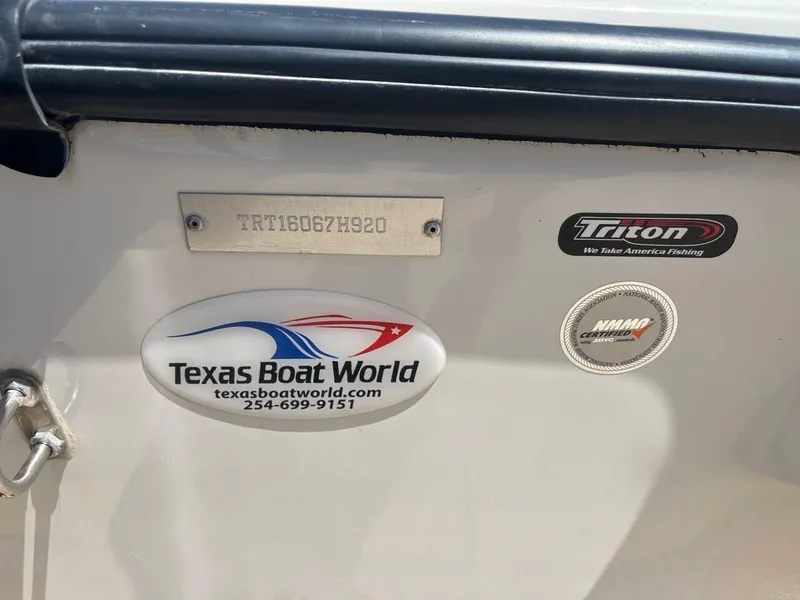 Slide: The Image of 2020 Triton 21 TRXS fishing boat with advanced equipment on a concrete surface. - 27