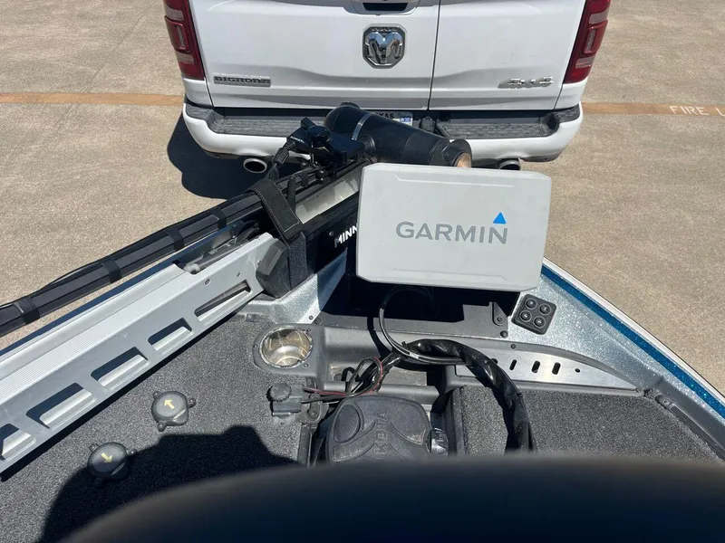 Slide: The Image of Open storage compartment in a 2020 Triton 21 TRXS boat. - 33