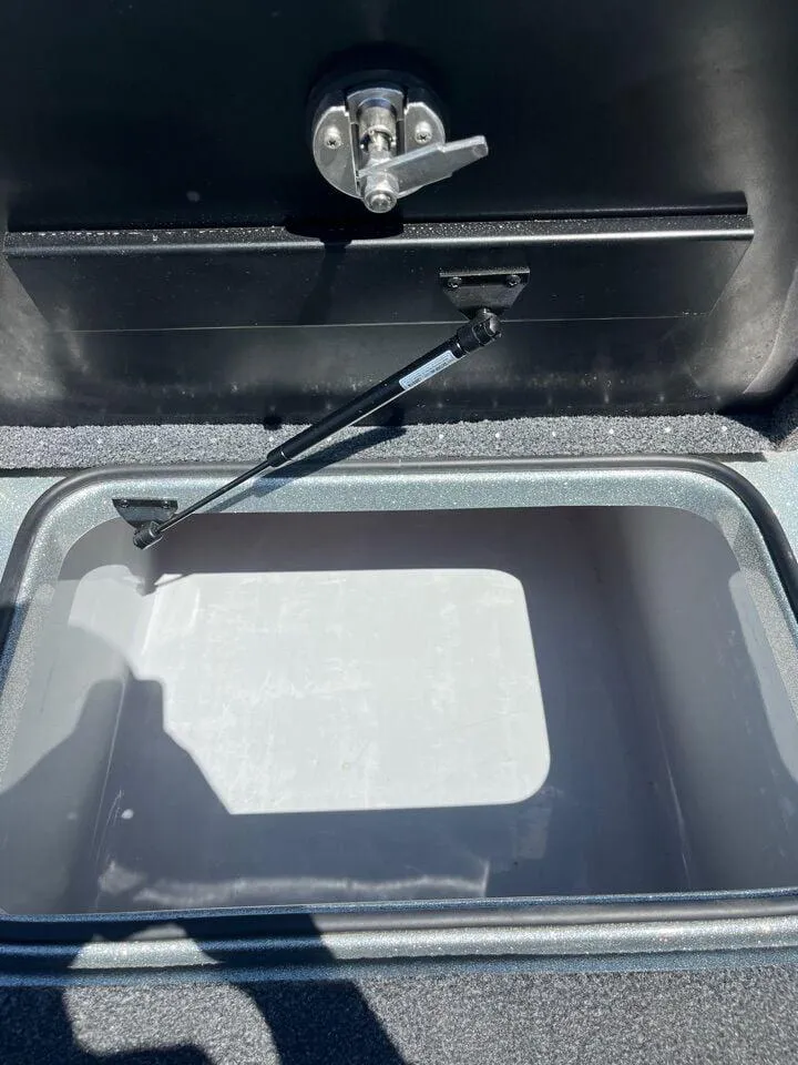 Slide: The Image of 2020 Triton 21 TRXS boat storage compartment with dual cup holders. - 34