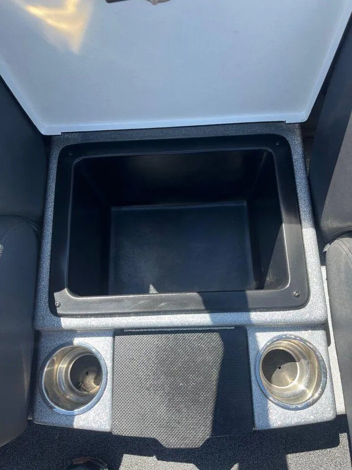 Slide: The Image of Control panel of a 2020 Triton 21 TRXS boat with various switches and gauges. - 37