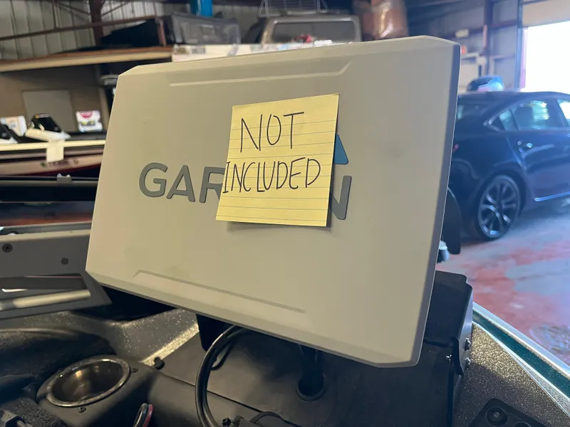 Slide: The Image of 2020 Triton 21 TRXS bass boat on trailer in parking lot. - 4